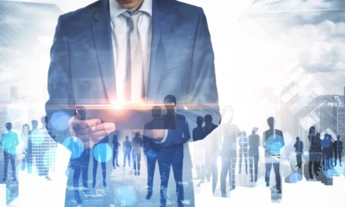 businessman-using-tablet-with-abstract-crowd-of-bu